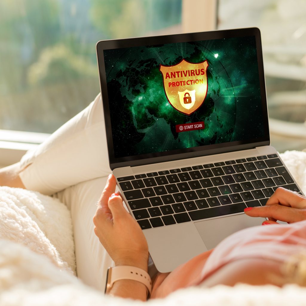 Woman Using Antivirus Software on Her Laptop
